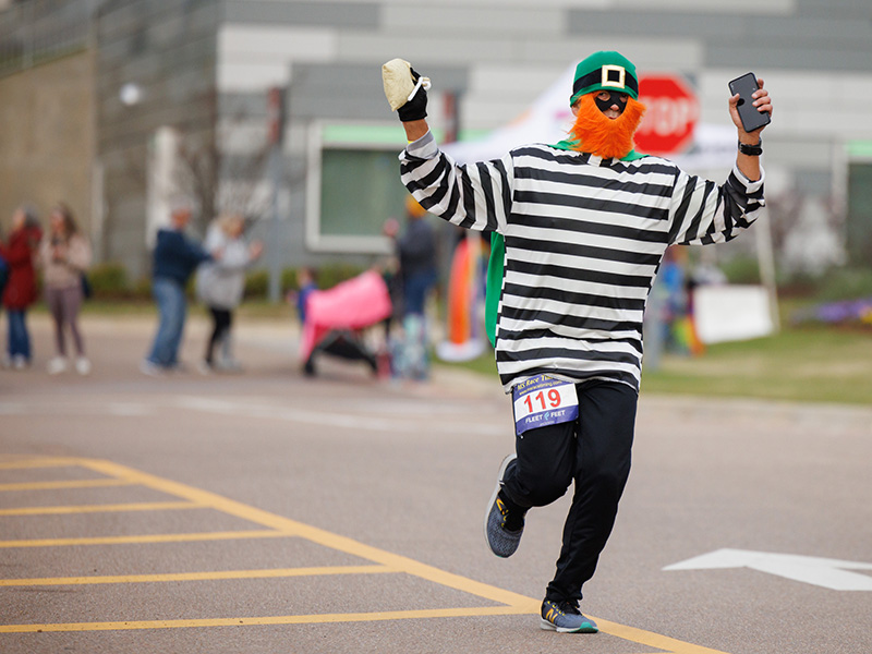 A leprechaun was among the 877 runners taking to Jackson's streets during Run the Rainbow for Children's.